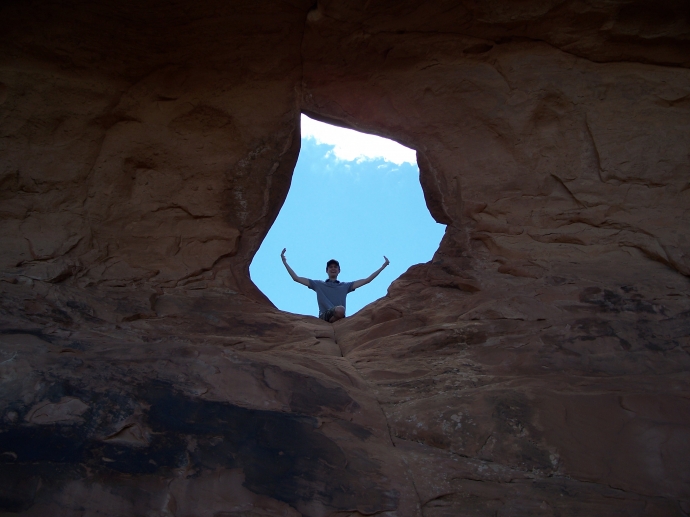 A picture of me sitting in Partition Arch at Arches National Park. The Arch overlooked the entire park and much more.
 By: Neal Grosskopf
 At: 6:57:52 PM 6/5/2011