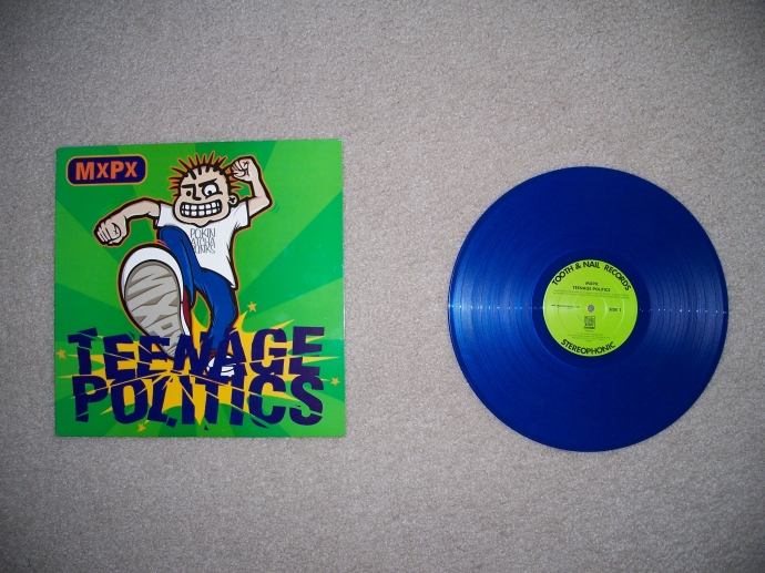 I bought another record recently! This one is MxPx's - Teenage Politics. I've always loved the spiked character they have on their album covers and this is one of the few I can get in vinyl with him on it.
 By: Neal Grosskopf
 At: 8:45:41 PM 8/2/2012